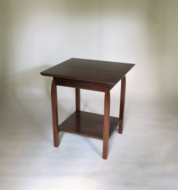 This side table is created from solid walnut and is the perfect size for sharing between two chairs